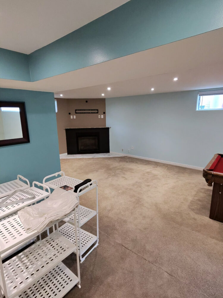 A beautifully restored North York basement featuring new drywall, fresh paint, and carpet, completed after a full interior waterproofing service by DGI.